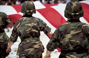 Soldiers with American Flag in Parade