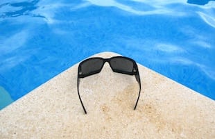 sunglasses by pool